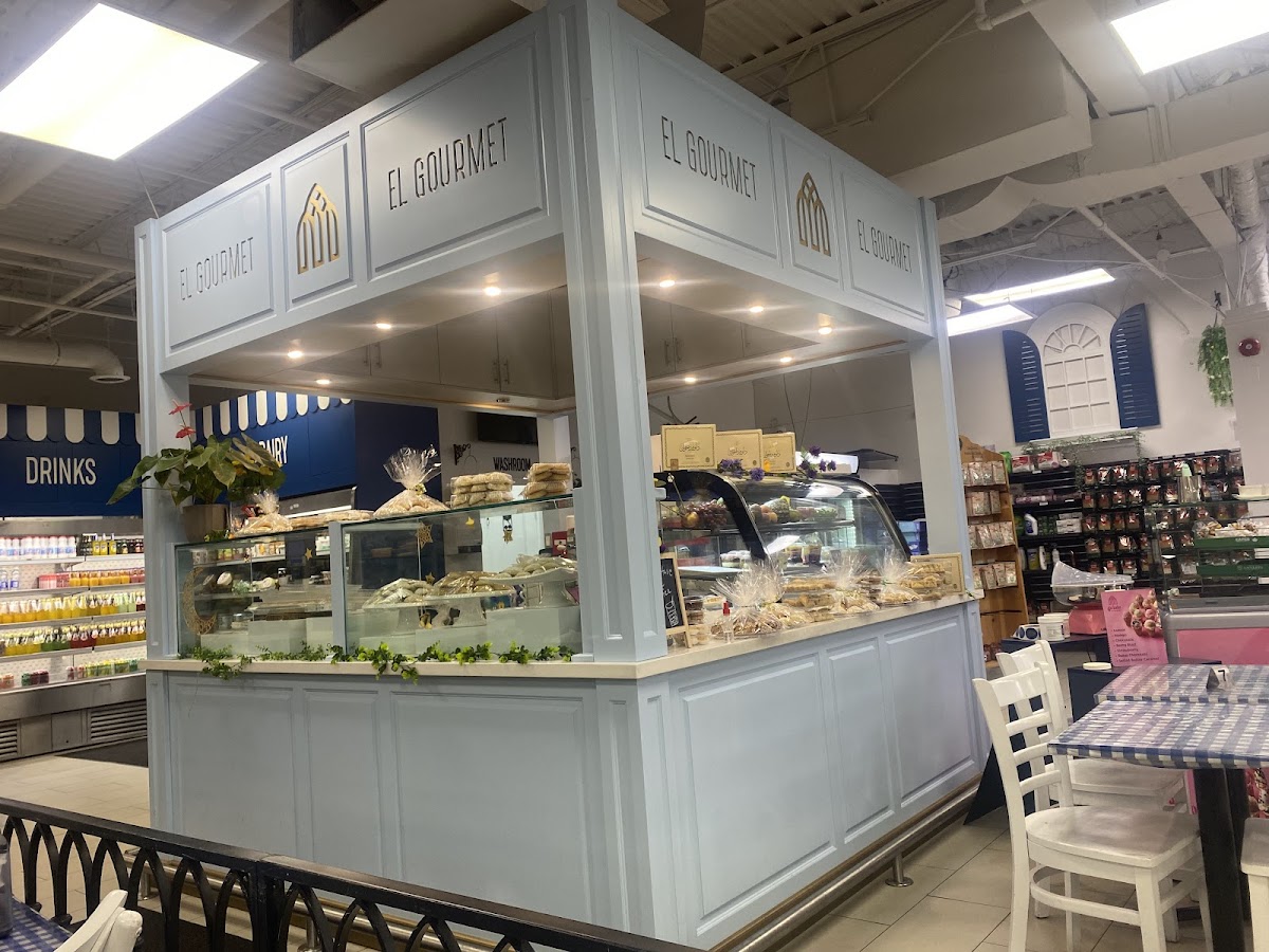 El Gourmet bakery counter with fresh pastries and breads