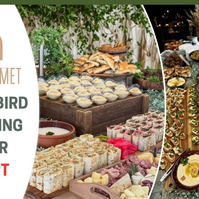 Catering spread with sandwiches, salads, and platters